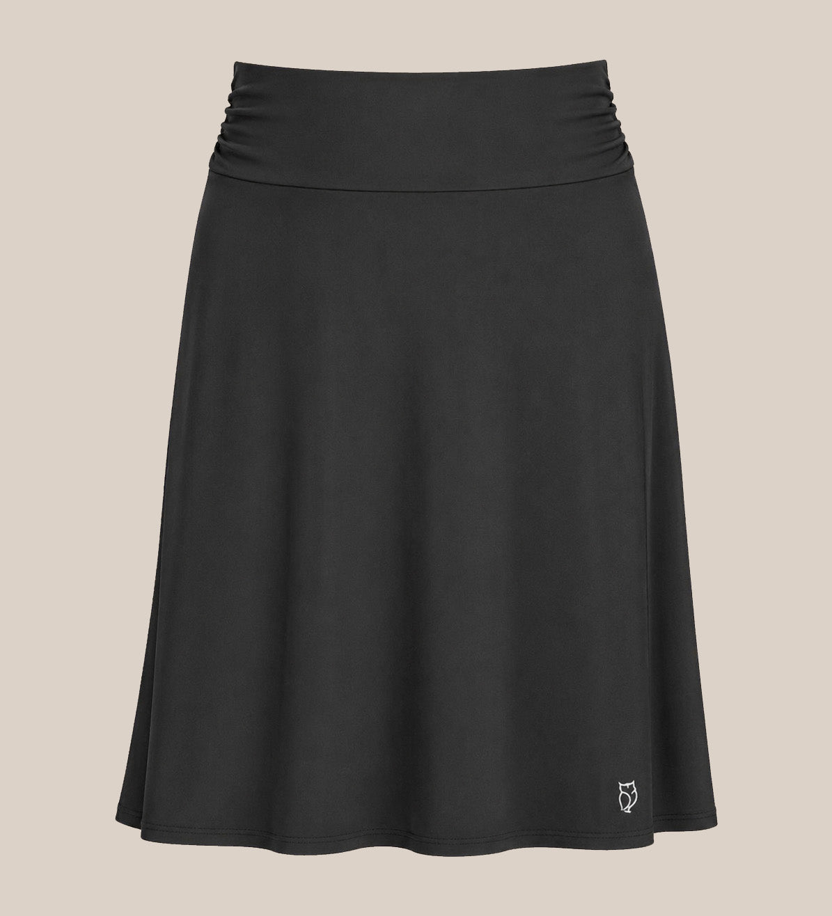 Black OWL skirt layered over leggings, knee-length, shown from the front